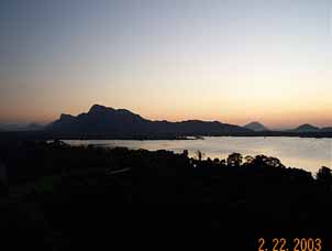 Sunset over a lake and mountains in Sri Lanka